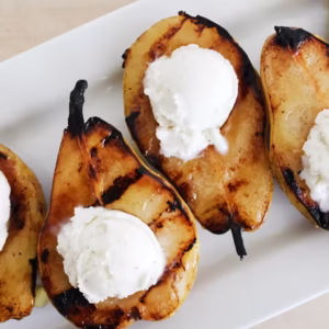 Grill Pears With Icre Cream And Yellow Fruit Syrup